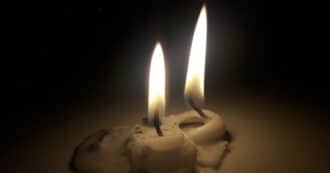 Two lit candles for Shabbat