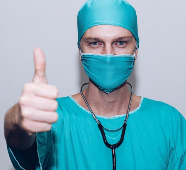 Plant based diet benefits A doctor giving the thumbs up sign