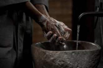 Photo of individual washing hands