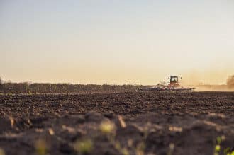 farmer ploughing field