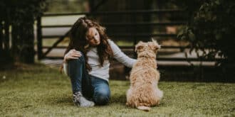 A young girl with her pet dog